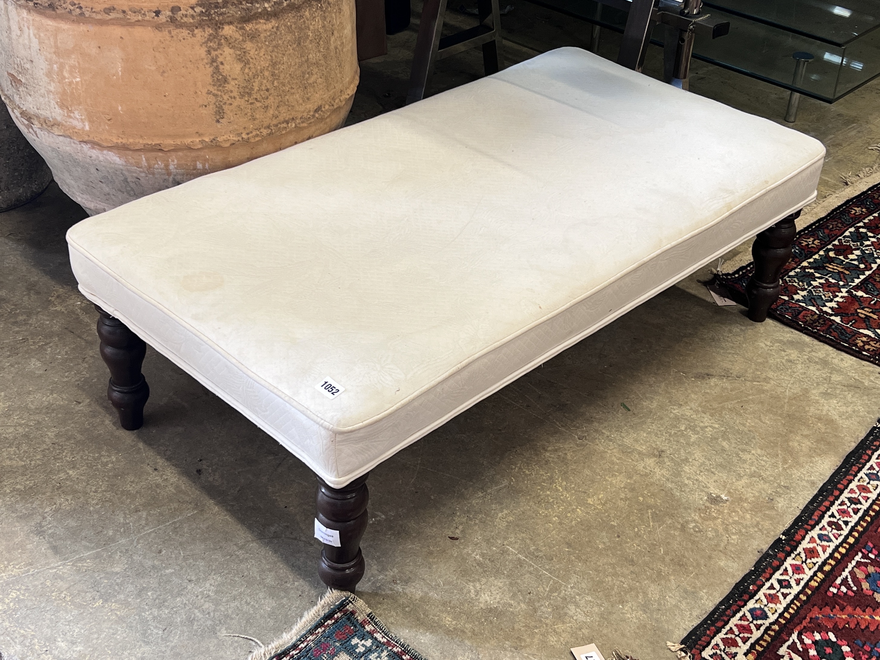 A Victorian style footstool, width 110cm, height 58cm